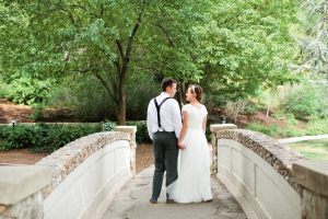 Bride and groom at bridge by Callie Hobbs